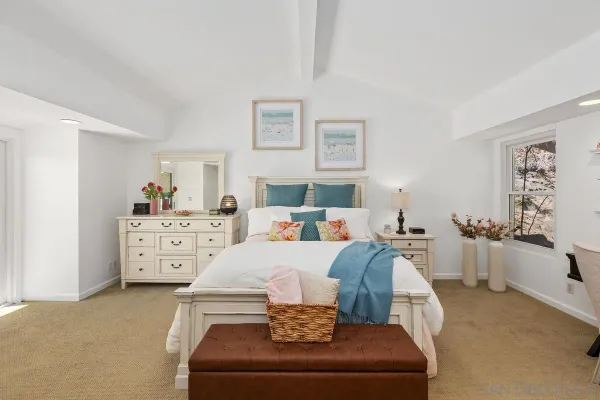a living room with furniture and white walls