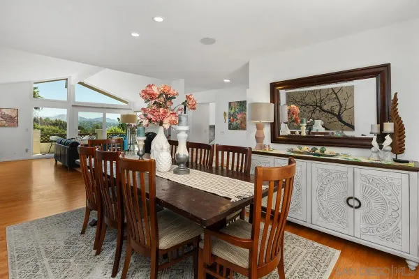a dining room with furniture and window
