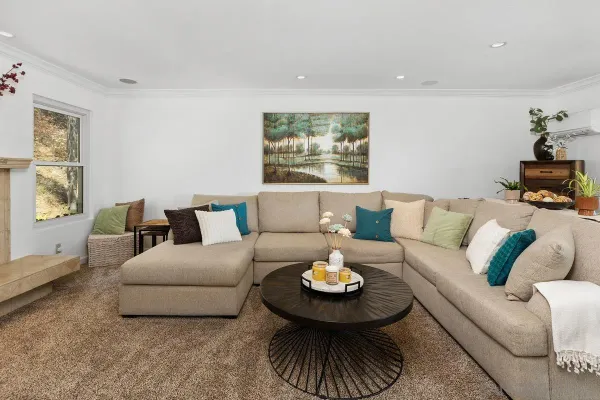 a living room with furniture and a table