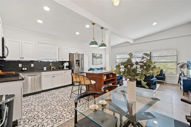 a kitchen with a sink stove and refrigerator