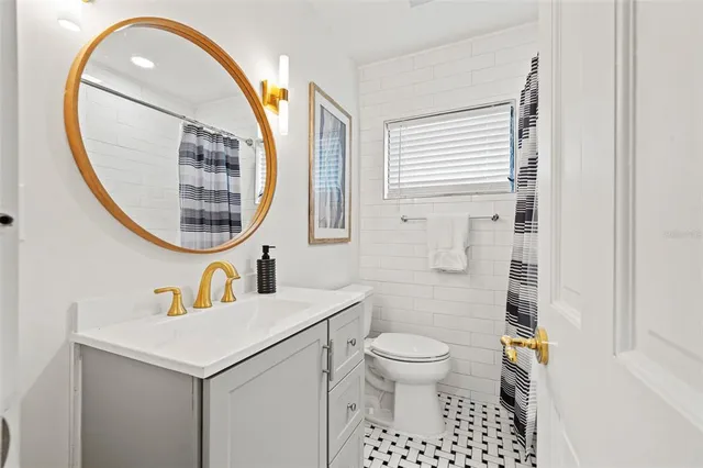 a bedroom with furniture and a flat screen tv