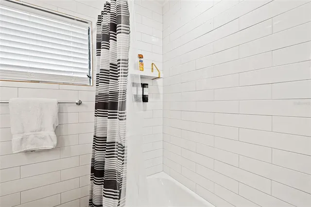 a bathroom with a toilet a sink and a shower