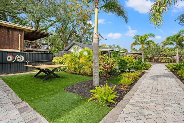 a view of a chair and tables in the garden