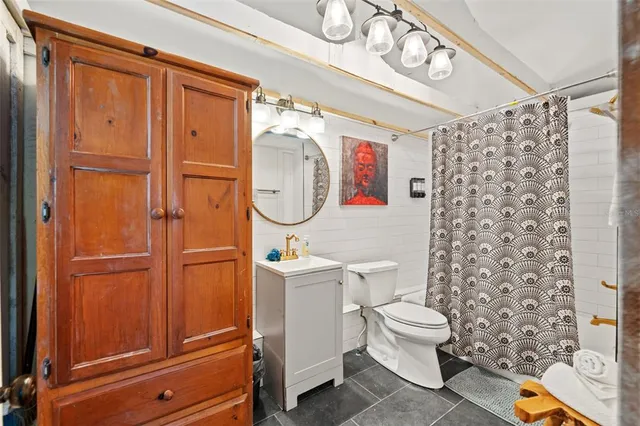 an aerial view of a house with a yard swimming pool and outdoor seating