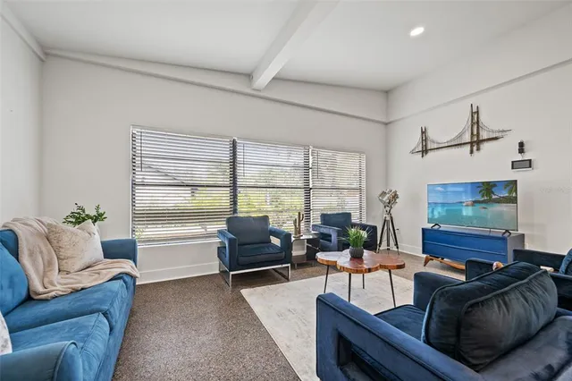 a large kitchen with a table and chairs