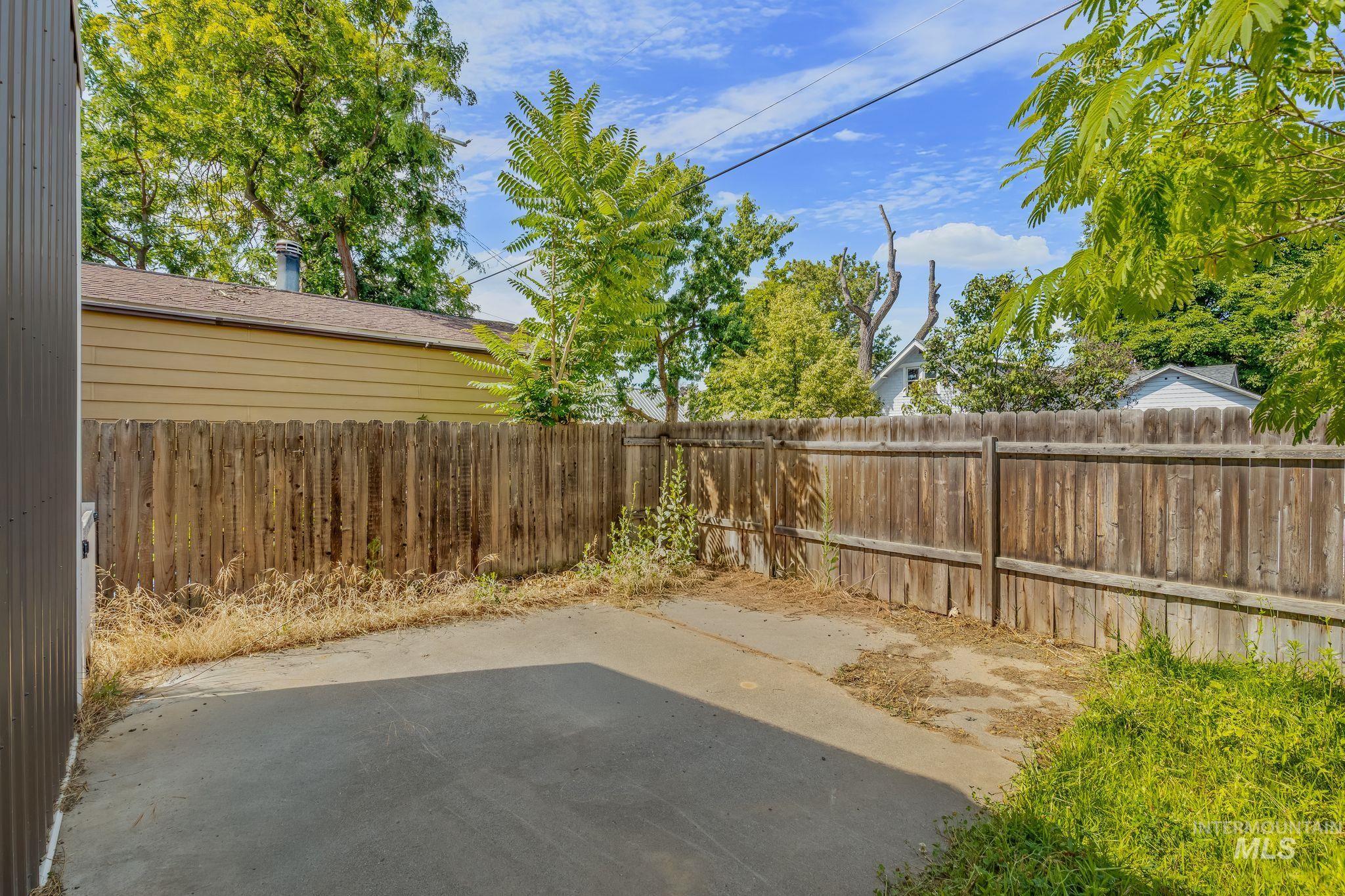 928 3rd Street Clarkston, WA 99403 - Photo 41 of 44 Paved outdoor space with a wood privacy fence