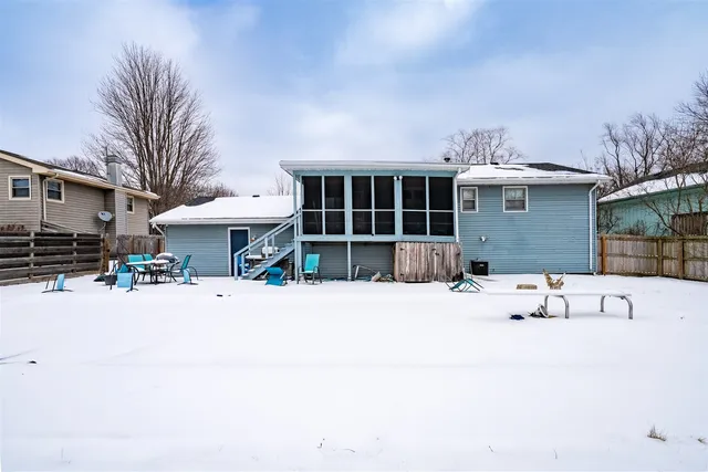 a front view of a house with a sitting area