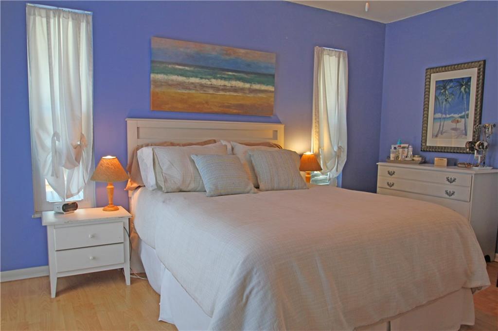 783 Northwest Spruce Ridge Drive Stuart, FL 34994 - Photo 13 of 29 a bedroom with a bed and a window