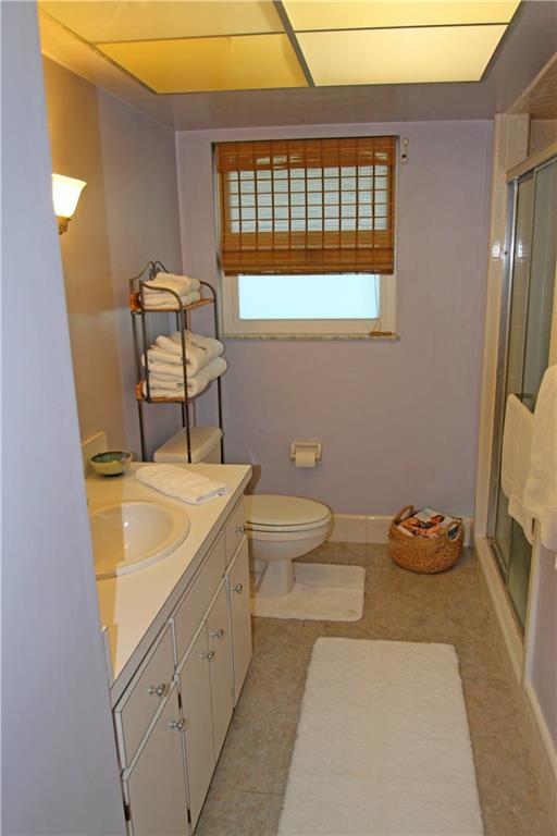 783 Northwest Spruce Ridge Drive Stuart, FL 34994 - Photo 14 of 29 a bathroom with a sink toilet and shower