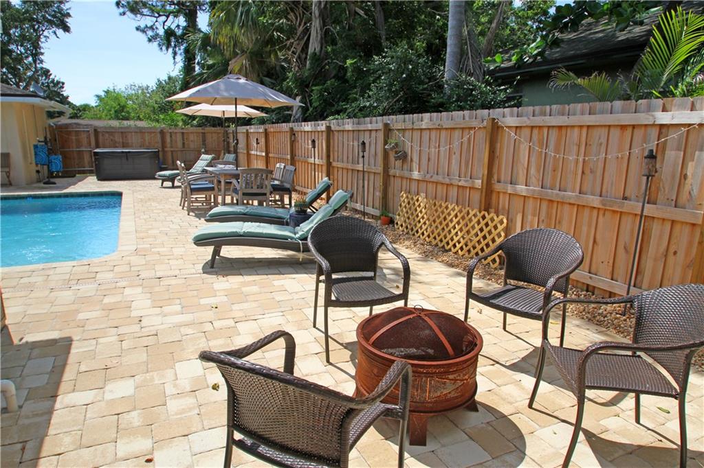 783 Northwest Spruce Ridge Drive Stuart, FL 34994 - Photo 18 of 29 a view of a chairs and tables in the patio