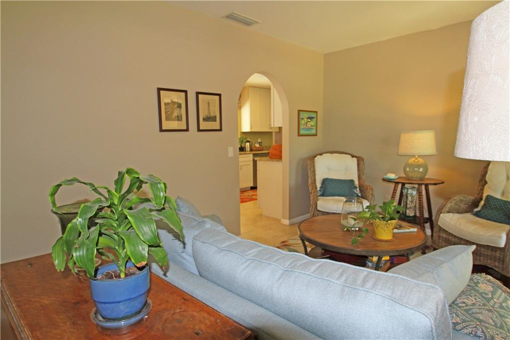 783 Northwest Spruce Ridge Drive Stuart, FL 34994 - Photo 5 of 29 a dining room with furniture and a potted plant