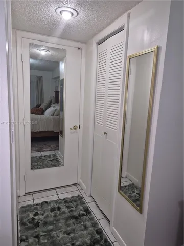 a view of balcony with two chairs and a table