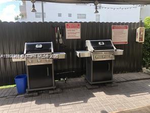 201 180th Drive, Unit 411 Sunny Isles Beach, FL 33160 - Photo 38 of 53 a view of a dinning room with furniture