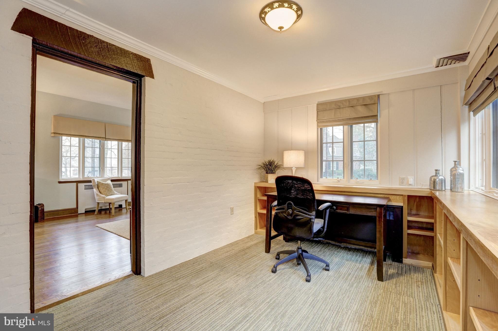 4501 Wetherill Road Bethesda, MD 20816 - Photo 8 of 29 Sunroom or office with lower built-in shelving