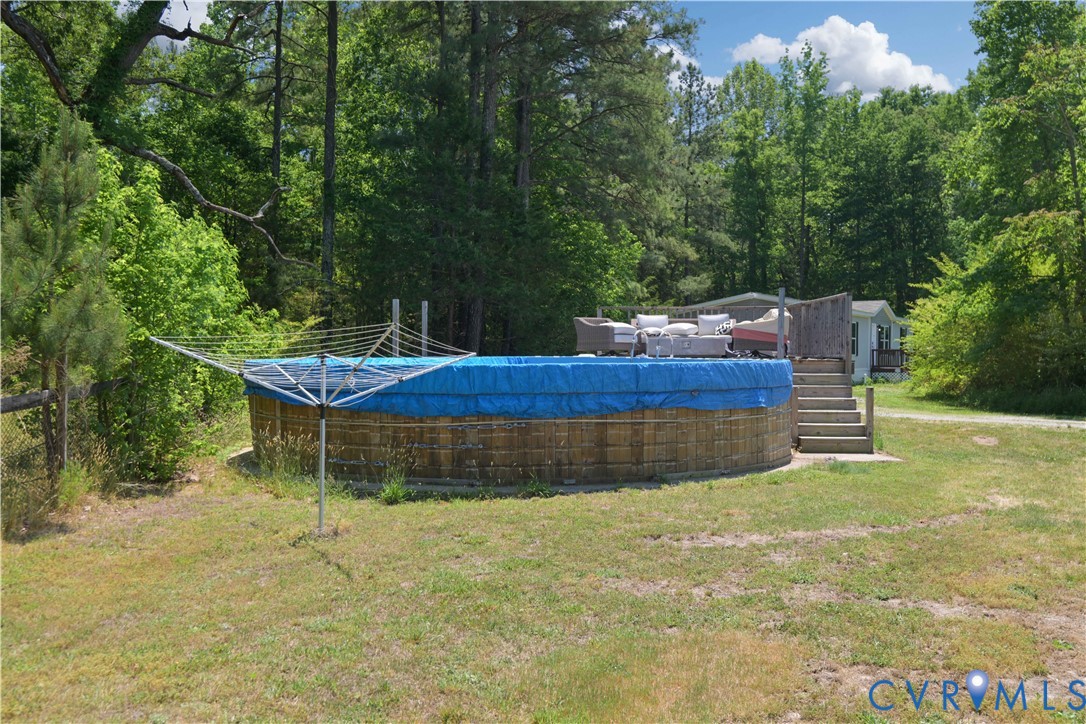 6243 Studley Road Mechanicsville, VA 23116 - Photo 58 of 65 a view of a backyard with swimming pool