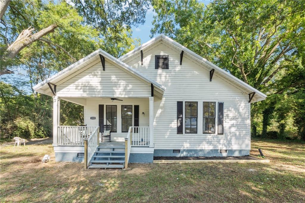 1820 Cassville Road Northwest Cartersville, GA 30121 - Photo 1 of 24 a front view of a house with a yard