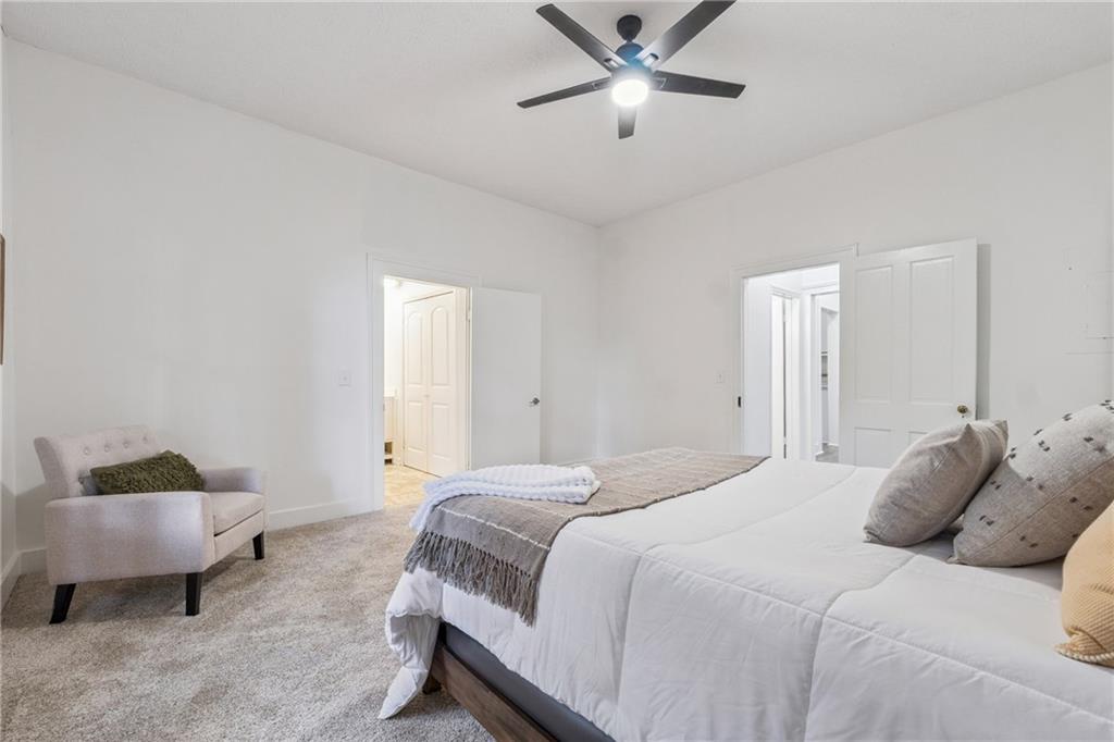 1820 Cassville Road Northwest Cartersville, GA 30121 - Photo 12 of 24 a bedroom with a bed and window