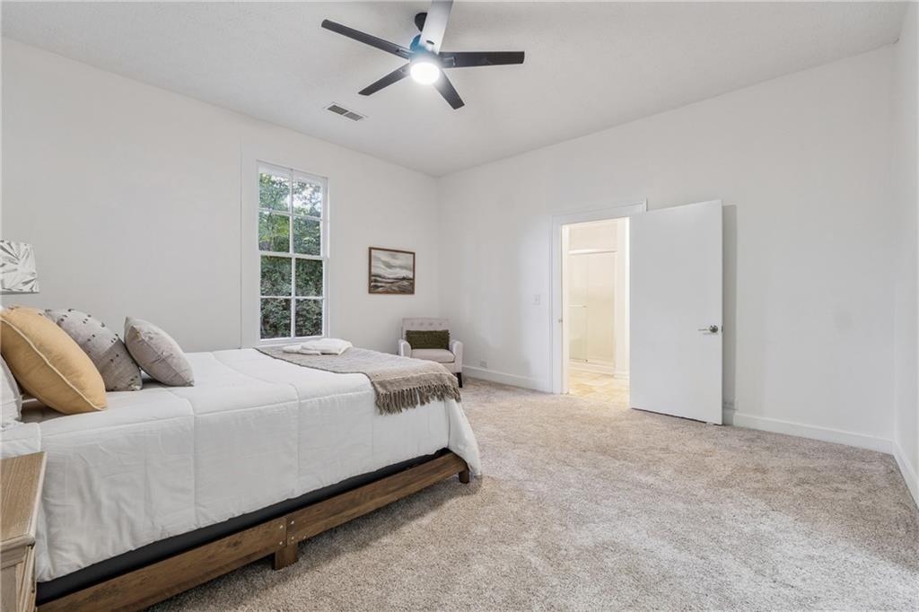 1820 Cassville Road Northwest Cartersville, GA 30121 - Photo 13 of 24 a bedroom with a bed and a window