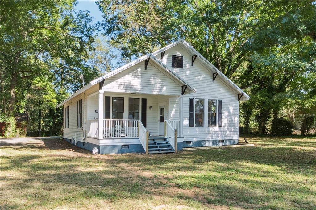 1820 Cassville Road Northwest Cartersville, GA 30121 - Photo 2 of 24 a front view of house with yard and green space