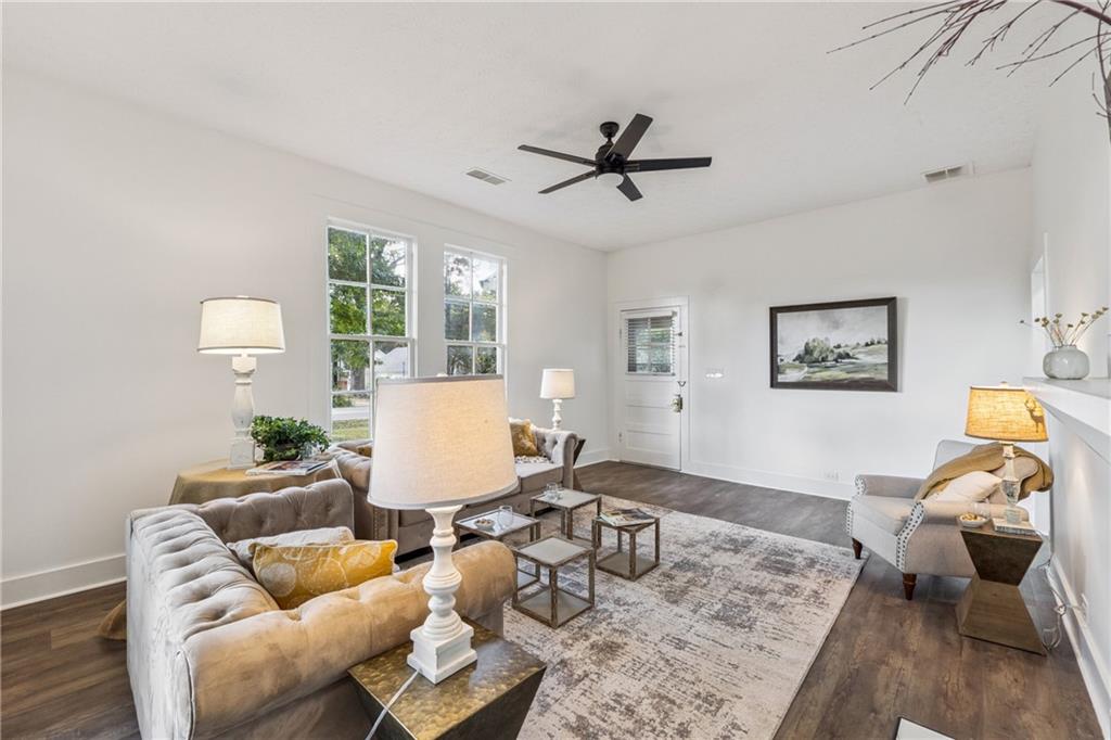 1820 Cassville Road Northwest Cartersville, GA 30121 - Photo 6 of 24 a living room with furniture and wooden floor
