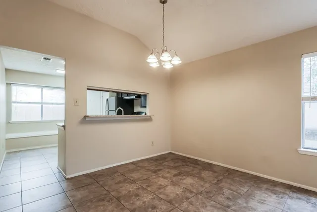a view of a room with window and cabinet