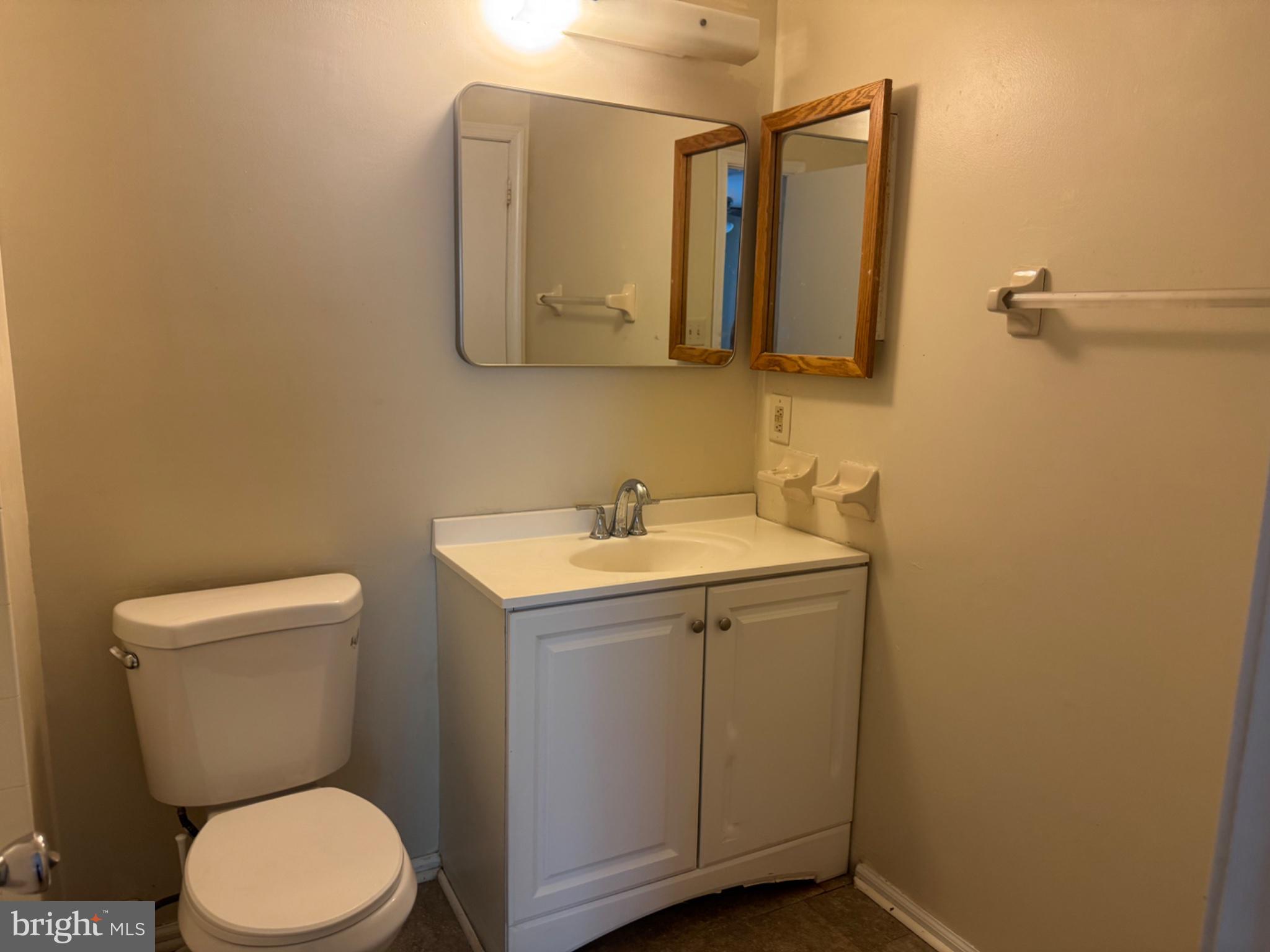 1908 B Ralston Drive Mount Laurel, NJ 08054 - Photo 14 of 21 a bathroom with a toilet a sink and mirror