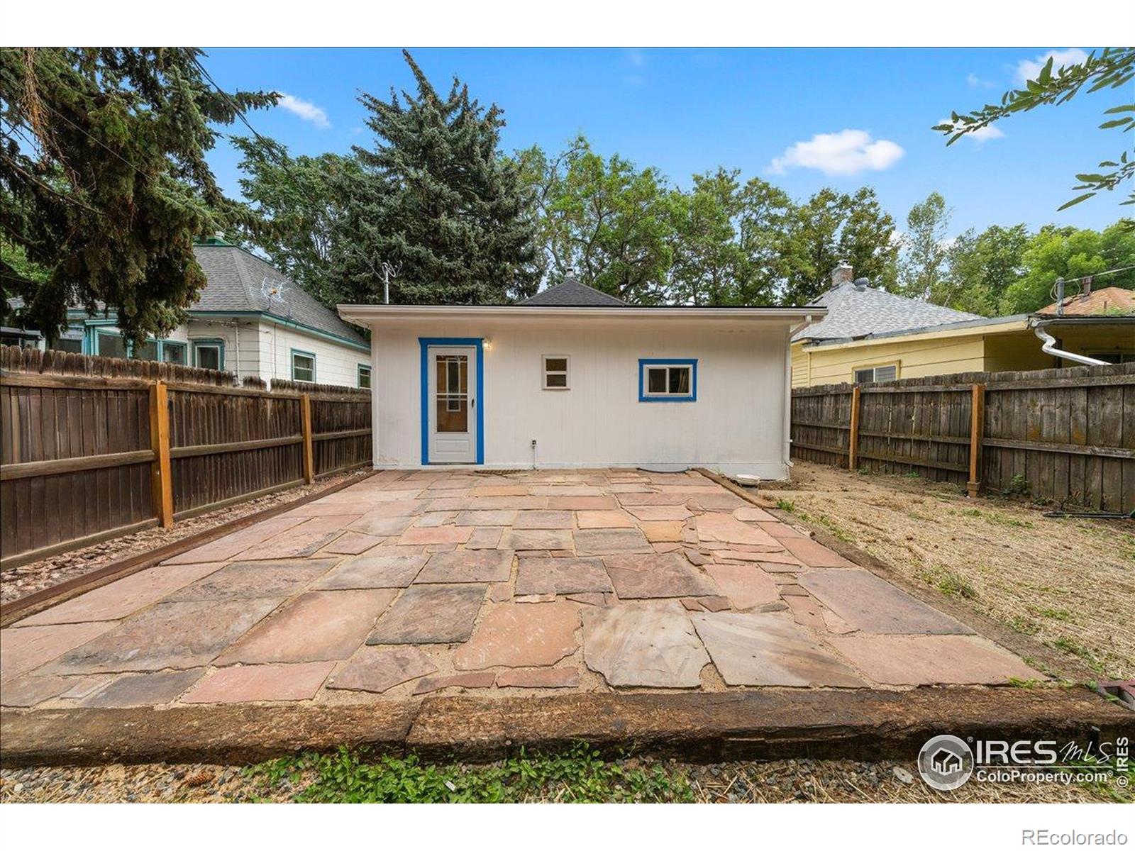 727 Baker Street Longmont, CO 80501 - Photo 21 of 25 a view of a backyard