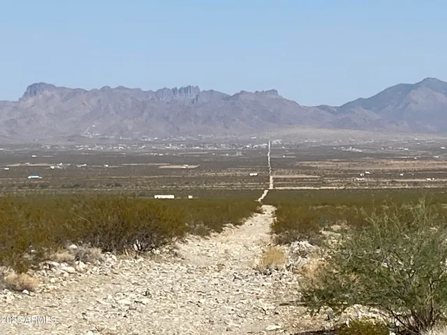 a view of a large body of water with a mountain in the background