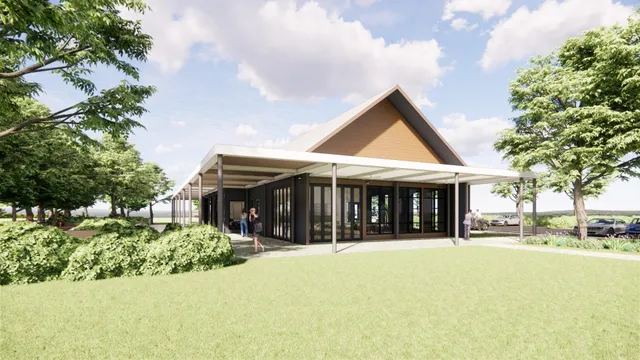 a view of house with yard and green space