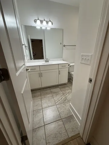 a room with a washing machine and sink