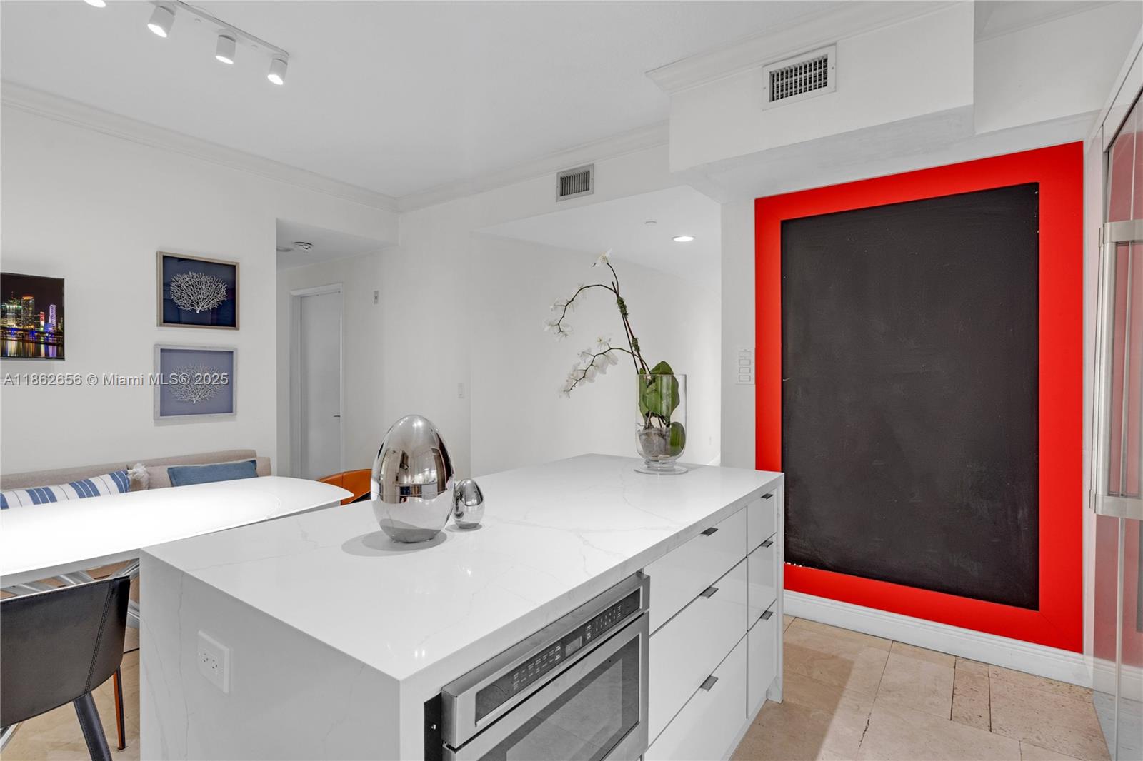 701 Crandon Boulevard, Unit 302 Key Biscayne, FL 33149 - Photo 28 of 46 a kitchen with a sink and a mirror