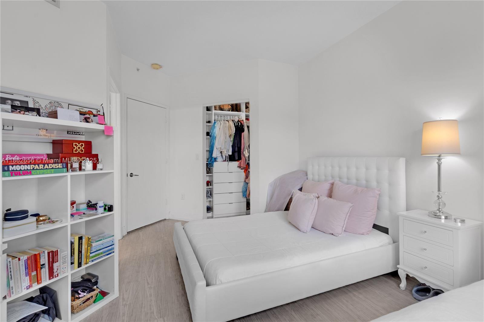 701 Crandon Boulevard, Unit 302 Key Biscayne, FL 33149 - Photo 36 of 46 a bedroom with a bed and closet