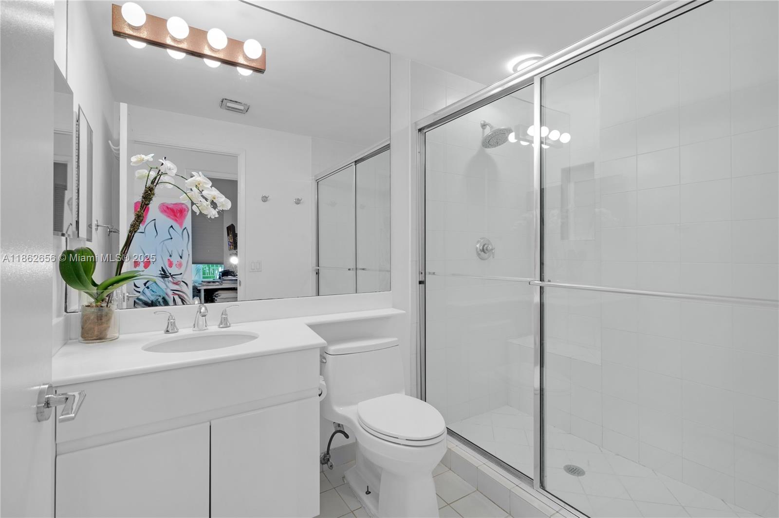 701 Crandon Boulevard, Unit 302 Key Biscayne, FL 33149 - Photo 38 of 46 a bathroom with a sink toilet and shower