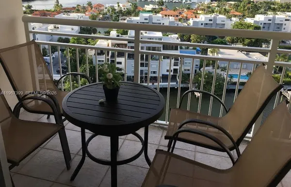 a view of a balcony with chairs