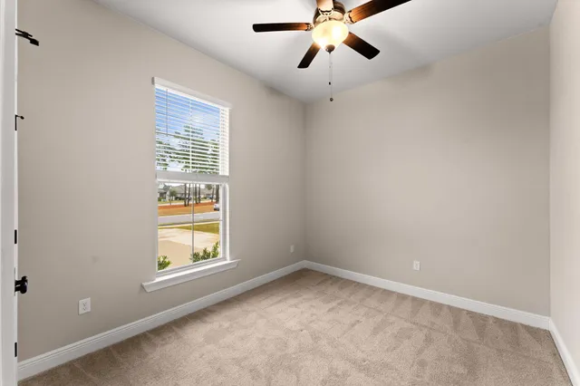 a bathroom with a double vanity sink toilet and a mirror