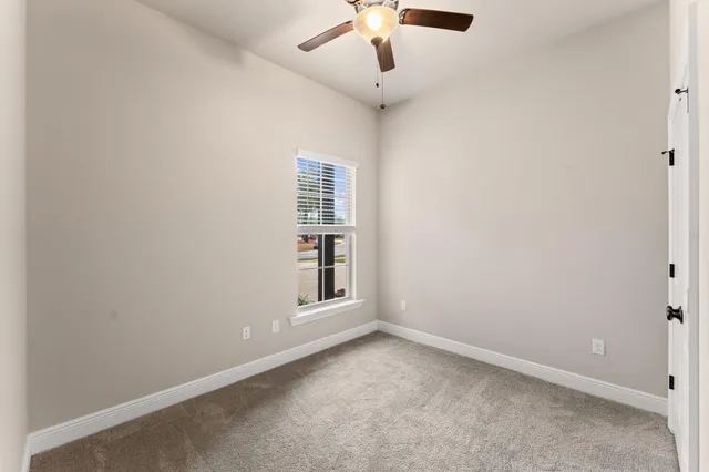 an empty room with fan