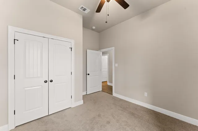 a bathroom with a sink a toilet a shower and a mirror