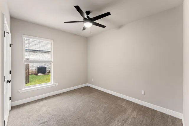 an empty room with fan