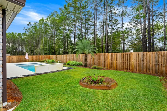 a view of a swimming pool with a garden