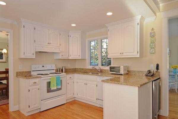 114 Peach Tree Road Marstons Mills, MA 02648 - Photo 6 of 18 a kitchen with stainless steel appliances granite countertop a sink stove and cabinets