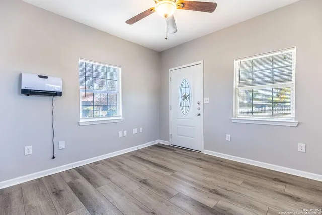 a view of entryway with wooden floor
