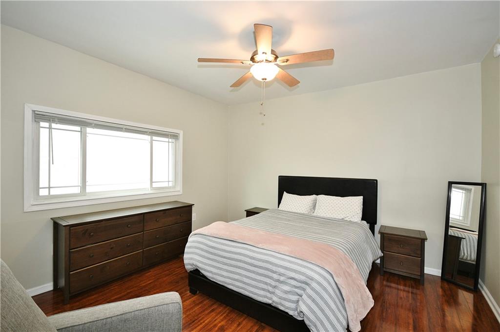1411 Eleanor Street Pittsburgh, PA 15210 - Photo 12 of 23 a bedroom with a bed and a window