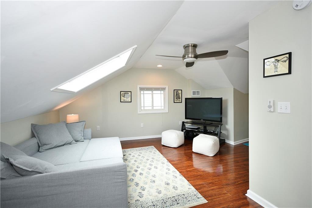 1411 Eleanor Street Pittsburgh, PA 15210 - Photo 18 of 23 a living room with furniture and a flat screen tv