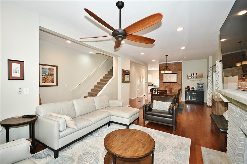 1411 Eleanor Street Pittsburgh, PA 15210 - Photo 3 of 23 a living room with furniture and a wooden floor