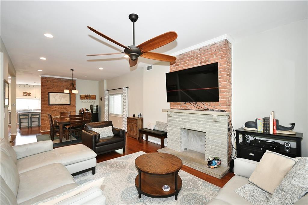 1411 Eleanor Street Pittsburgh, PA 15210 - Photo 4 of 23 a living room with furniture and a flat screen tv