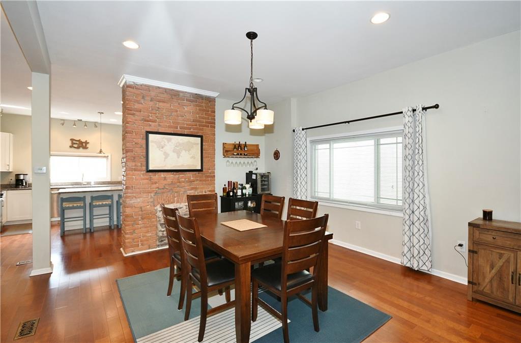 1411 Eleanor Street Pittsburgh, PA 15210 - Photo 6 of 23 a dining room with furniture window wooden floor