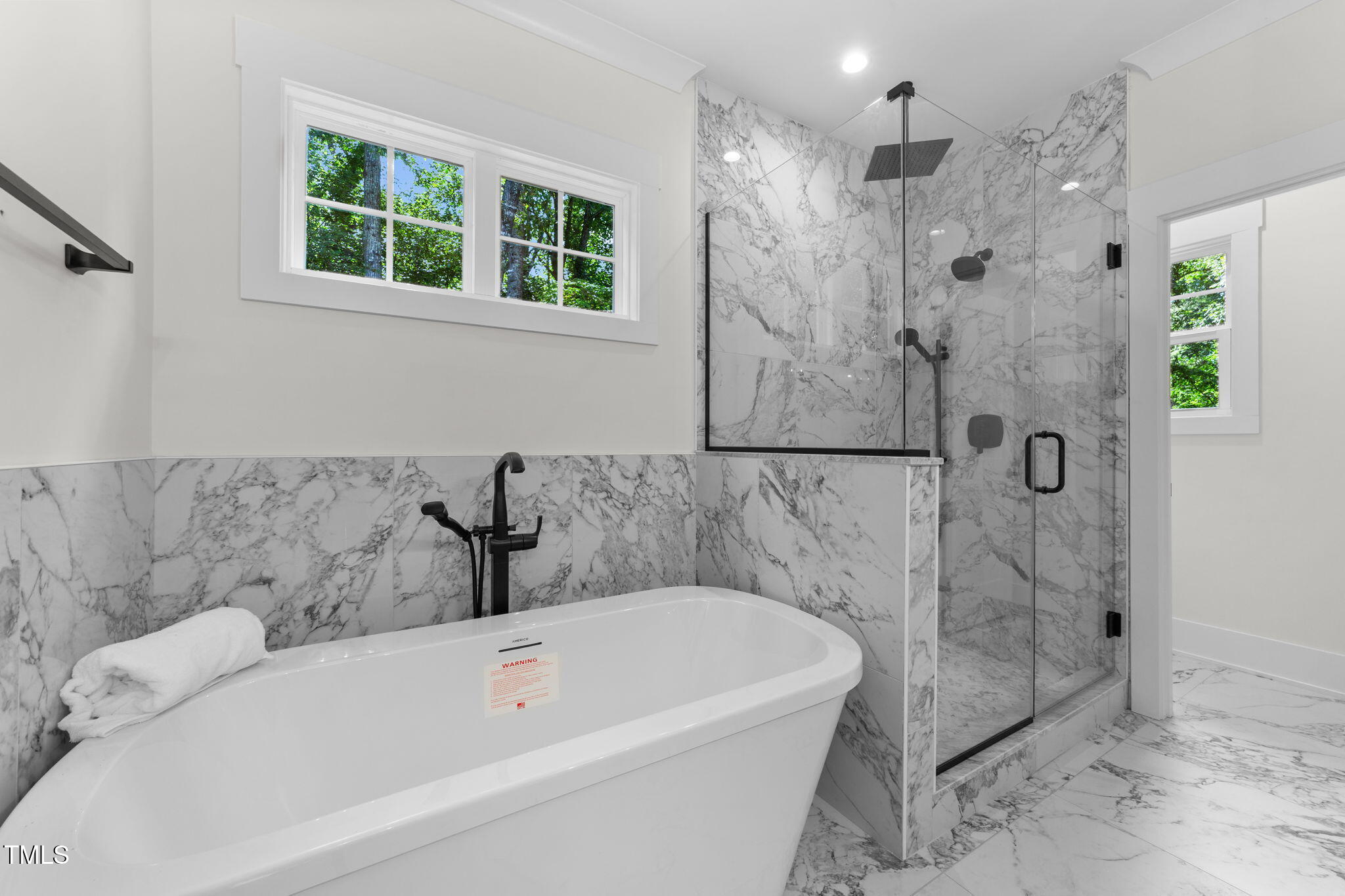 2817 Silk Hope Gum Springs Road Pittsboro, NC 27312 - Photo 24 of 56 a bathroom with a bathtub and shower