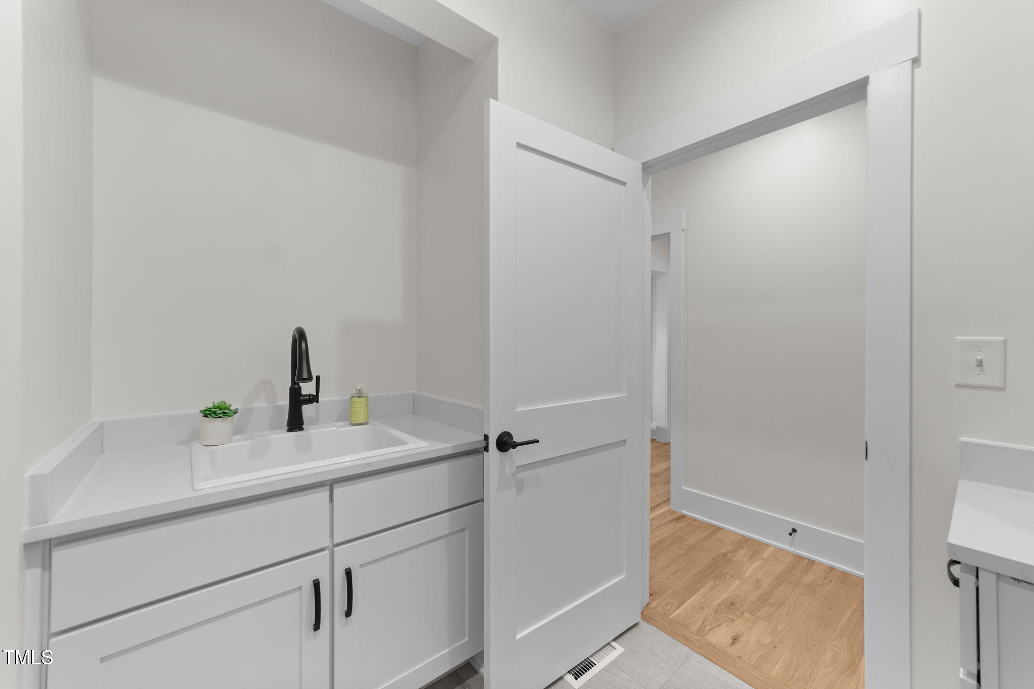 2817 Silk Hope Gum Springs Road Pittsboro, NC 27312 - Photo 28 of 56 a bathroom with a sink and a shower