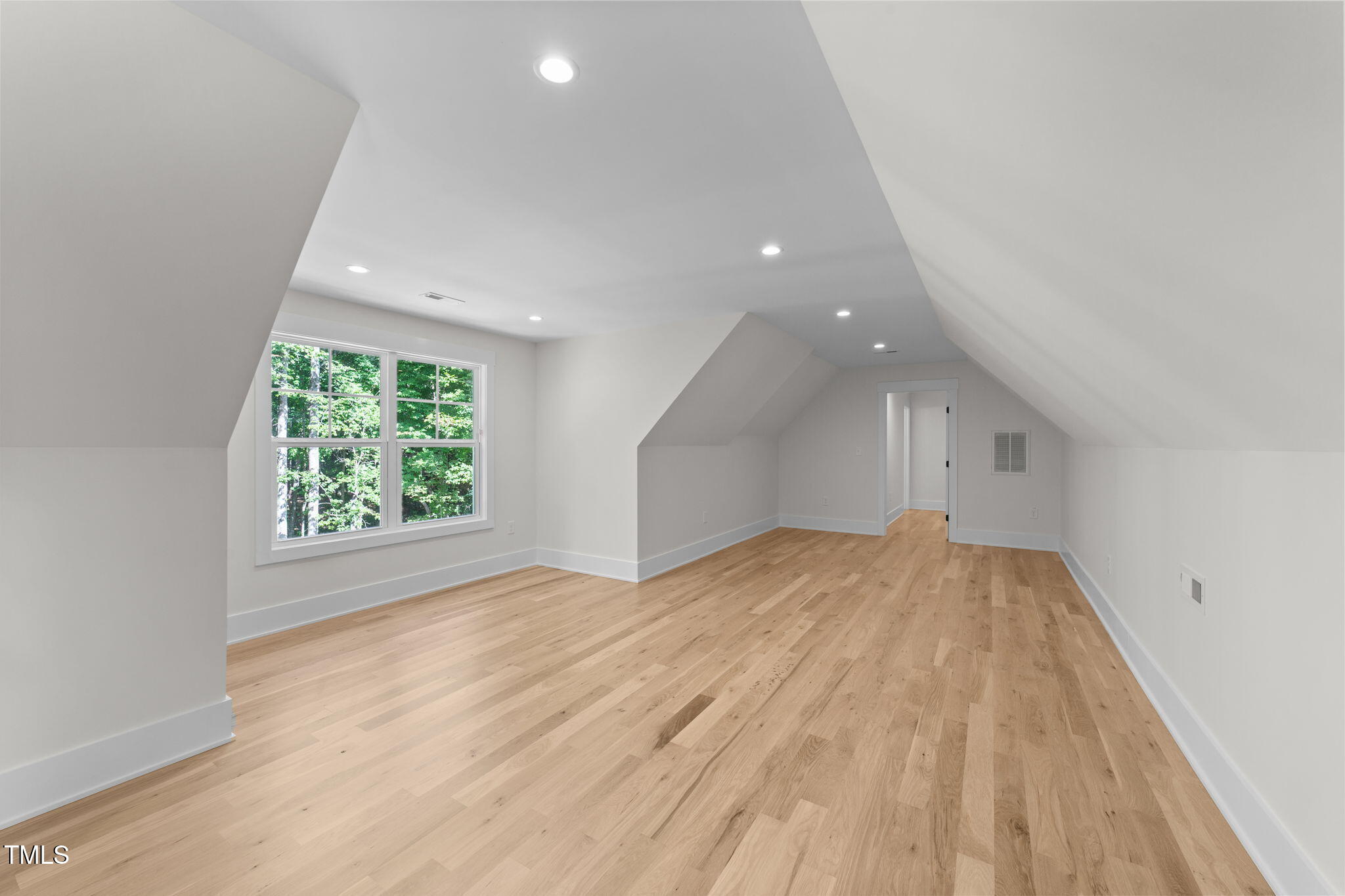 2817 Silk Hope Gum Springs Road Pittsboro, NC 27312 - Photo 39 of 56 a view of empty room with wooden floor and fan