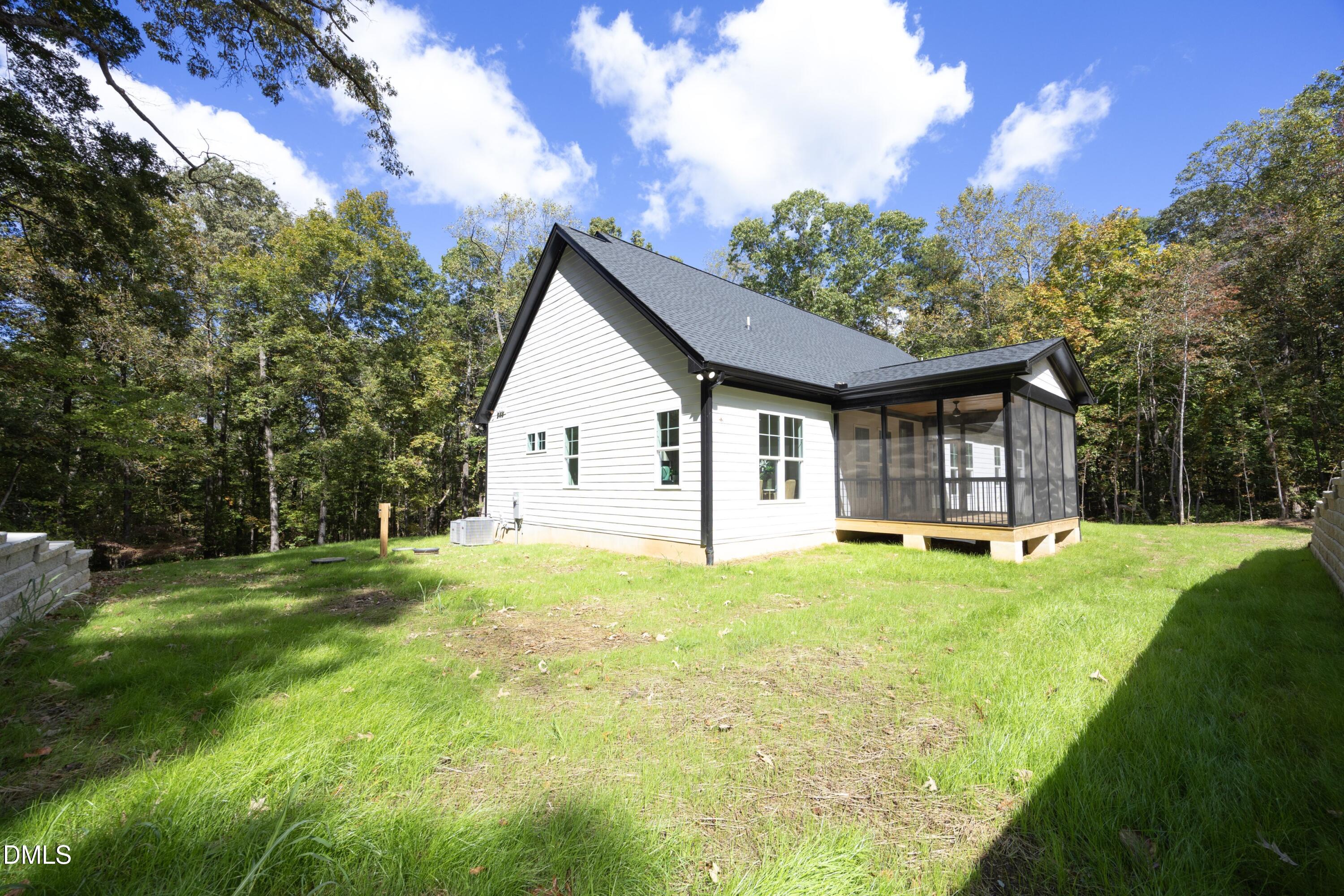 2817 Silk Hope Gum Springs Road Pittsboro, NC 27312 - Photo 42 of 56 a view of a house with backyard and sitting area